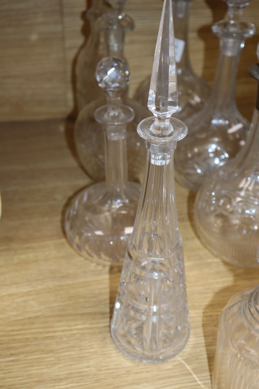 A silver collared decanter and eight other decanters, tallest 46cm incl. stopper